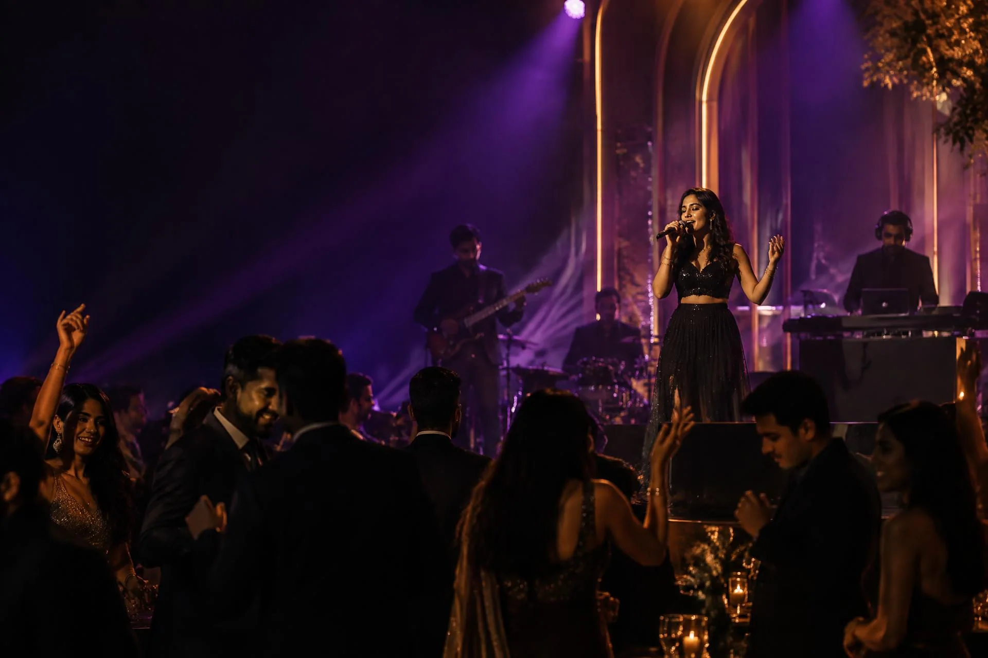 Singer and live band performing for guests at an evening celebration